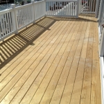 Pressure treated deck-vinyl railings